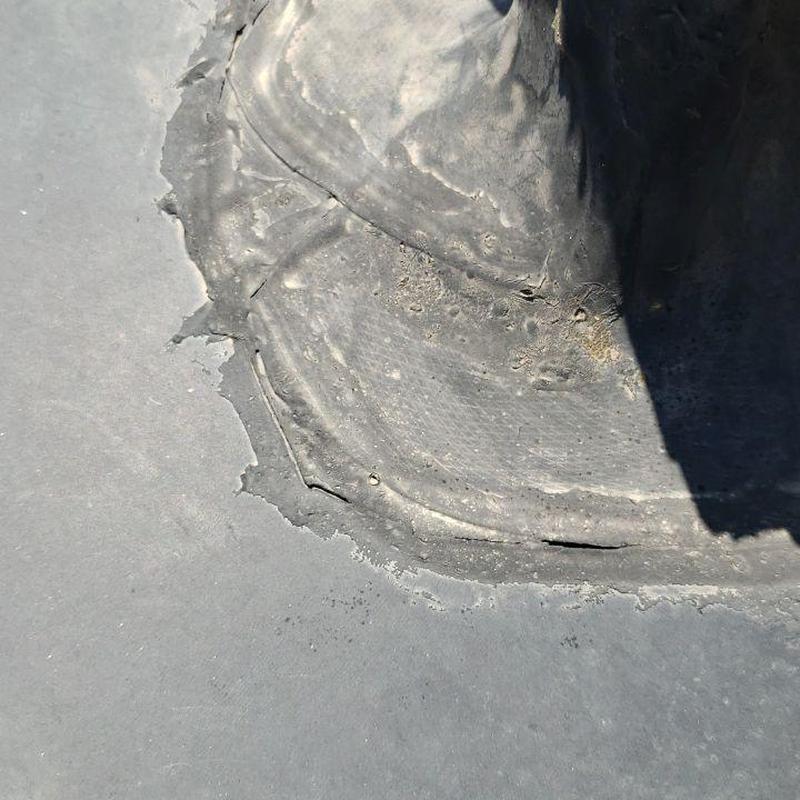 EPDM roof seam damage with holes and deterioration EPDM roof seam damage with holes and deterioration