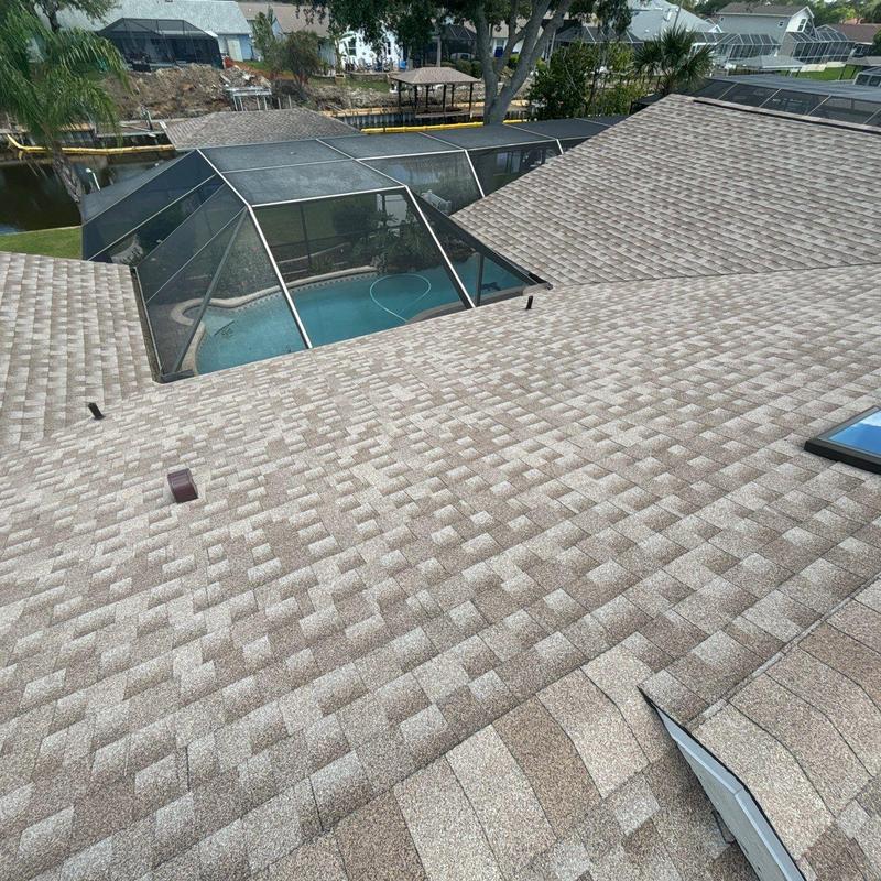 Architectural shingle roof with skylights and screened pool Architectural shingle roof with skylights and screened pool