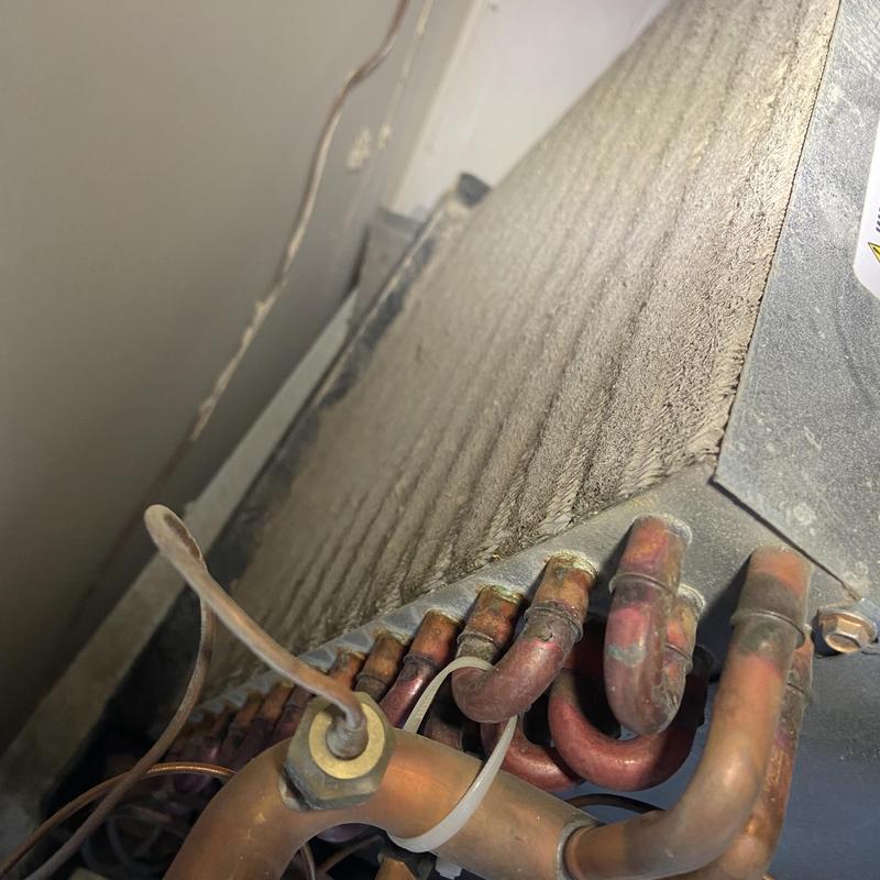 Air conditioner coil and copper tubing clogged with dirt