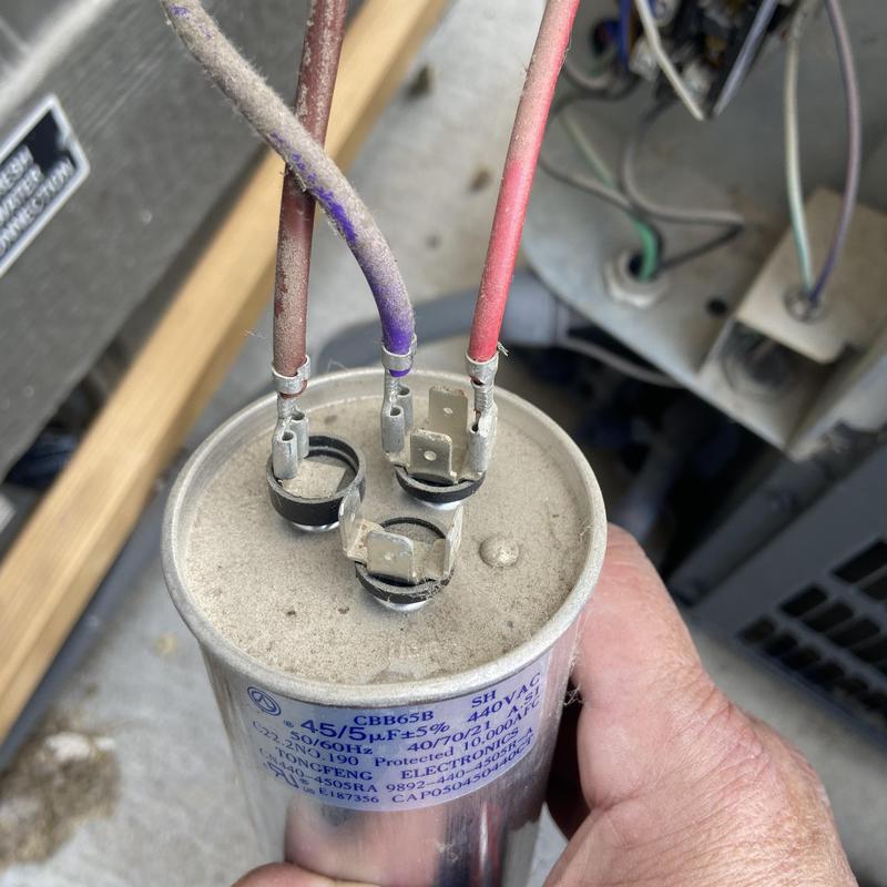 AC capacitor with dust and wiring on HVAC unit