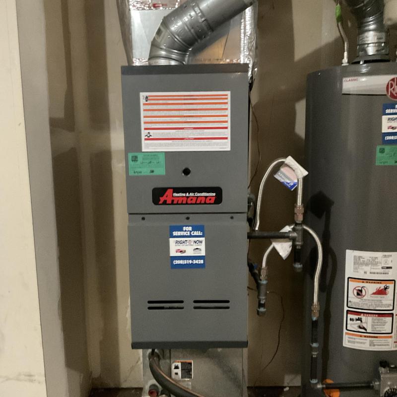 Amana furnace and ductwork in utility room