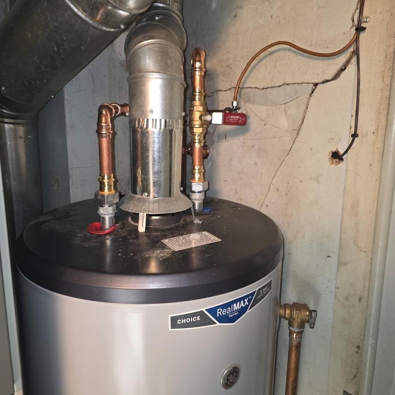 Water heater with copper pipe connections and vent pipe