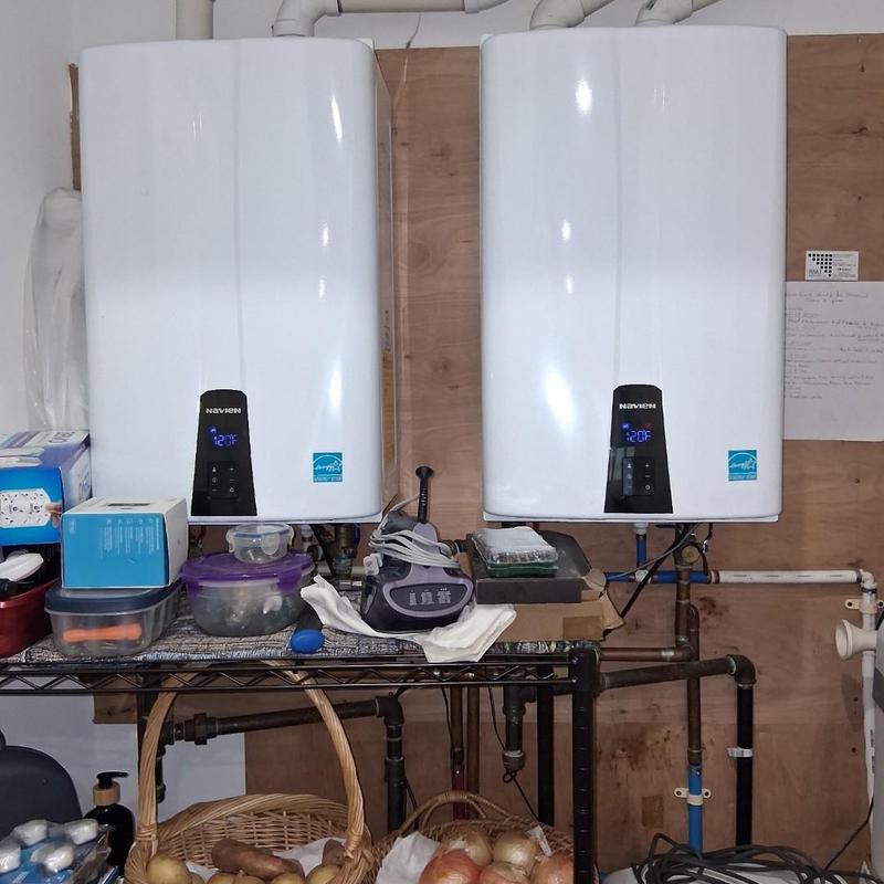 Tankless water heaters with digital controls in utility room