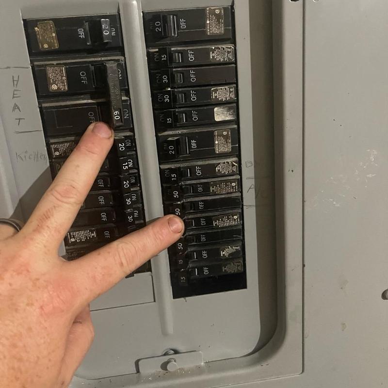 Electrical breaker panel showing circuit breaker switches Electrical breaker panel showing circuit breaker switches