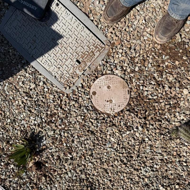 Pressure reducing valve installation near meter box on gravel