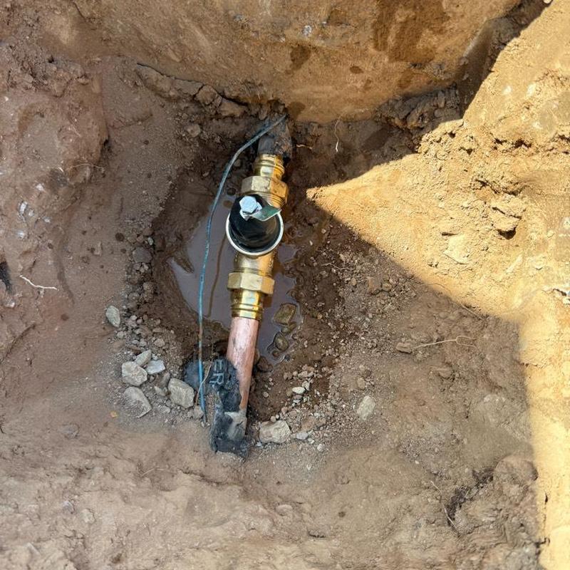 Pressure relief valve on main water line in dirt hole