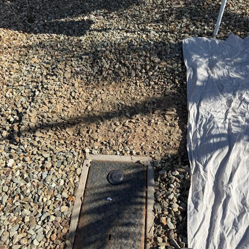 Main water line access box set in gravel bed