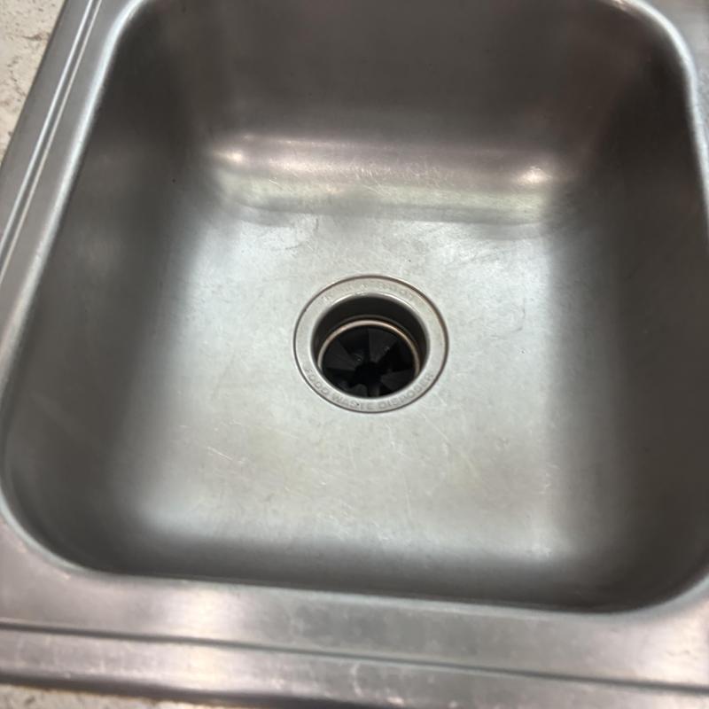 Kitchen sink drain and garbage disposal unit opening