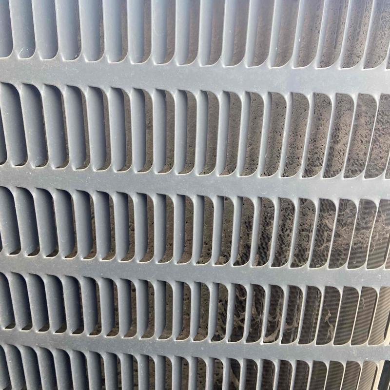 Mini split outdoor unit close-up with dust buildup