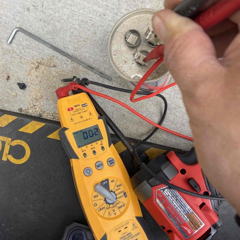 Electrical system voltage testing with multimeter and tools