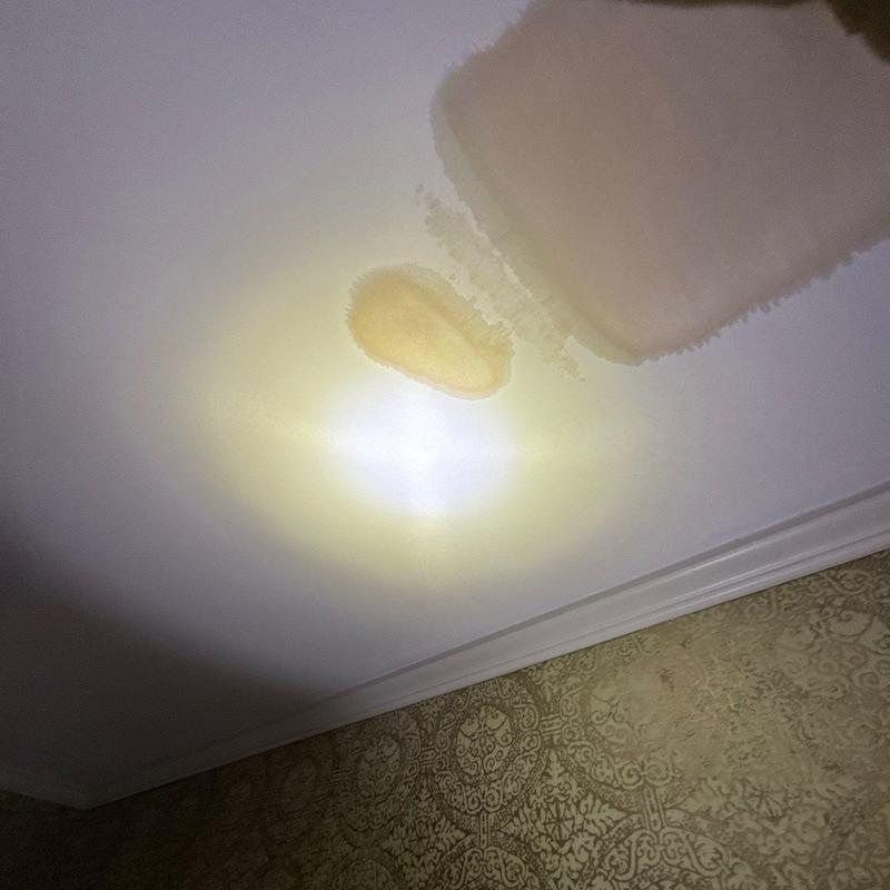 Ceiling drywall water damage with discoloration stains