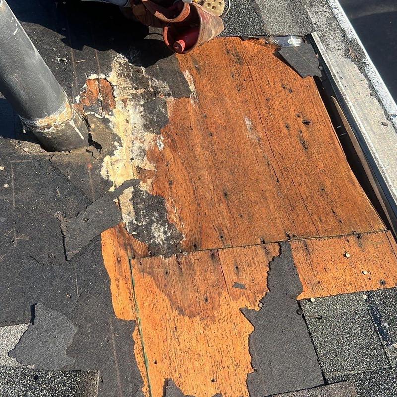 Roof plywood deck with water damage and deterioration