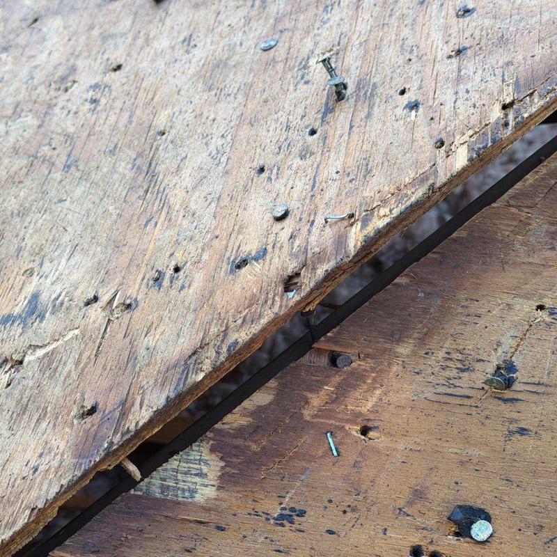 Roof sheathing with loose and missing nails