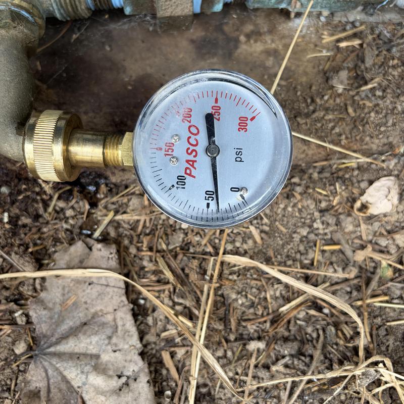 Well system pressure gauge showing 60 psi reading Well system pressure gauge showing 60 psi reading