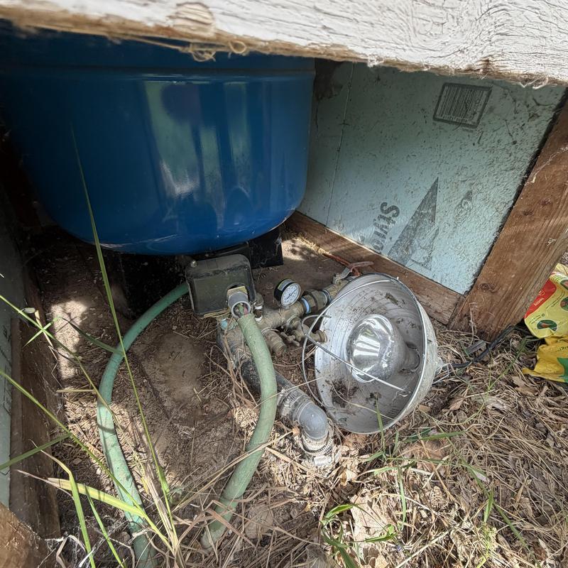Well pressure tank and piping with pressure gauge Well pressure tank and piping with pressure gauge
