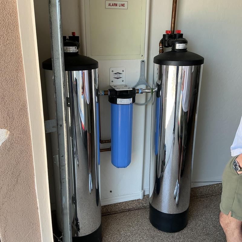 Blue water filter cartridge between steel tanks