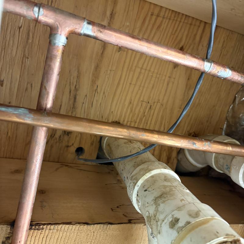Copper waterline T intersection with PVC drain piping Copper waterline T intersection with PVC drain piping