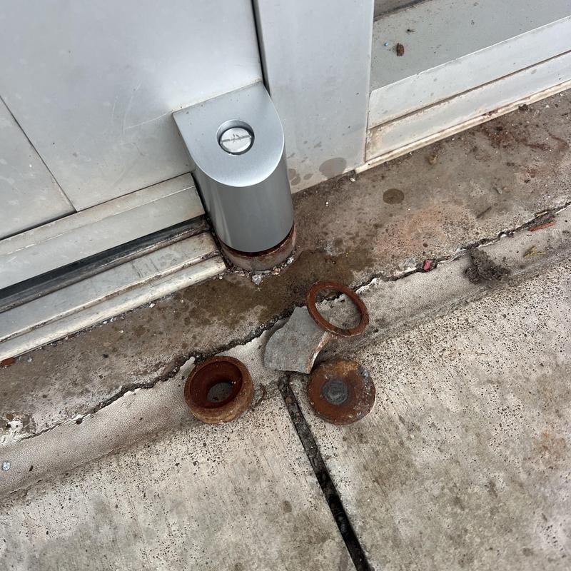 Front door lower pivot parts and installed upper pivot