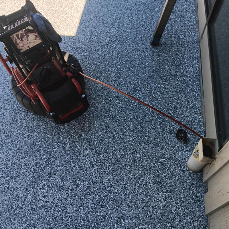 Drain pipe CCTV inspection camera on patio surface