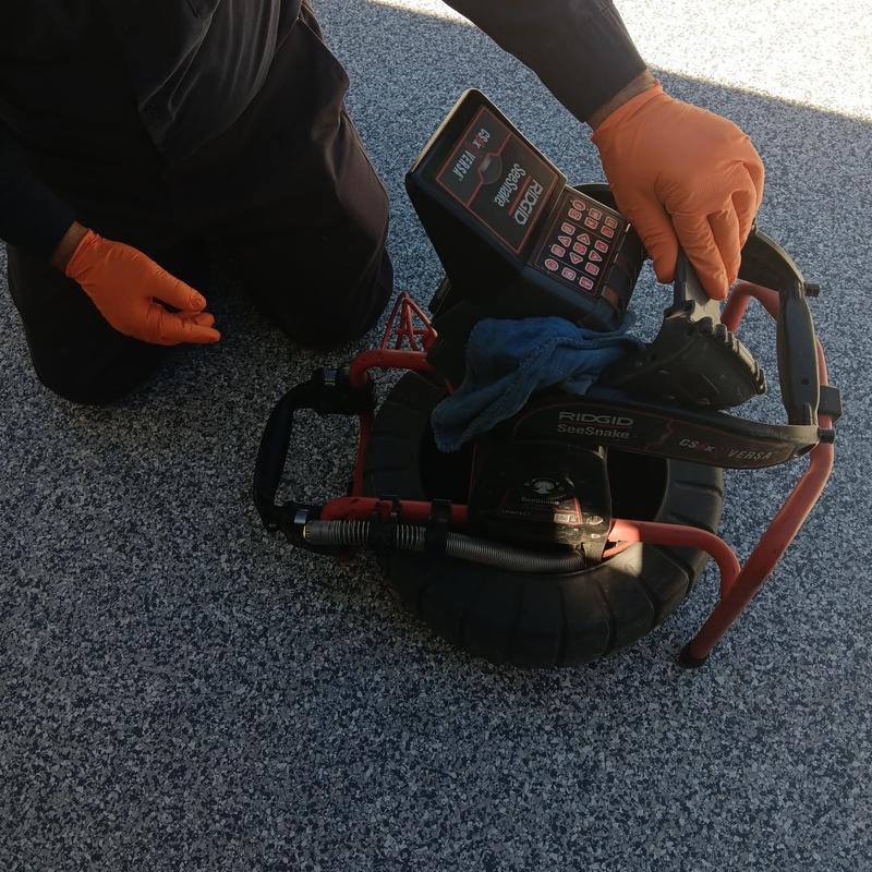CCTV sewer inspection camera with operator gloves
