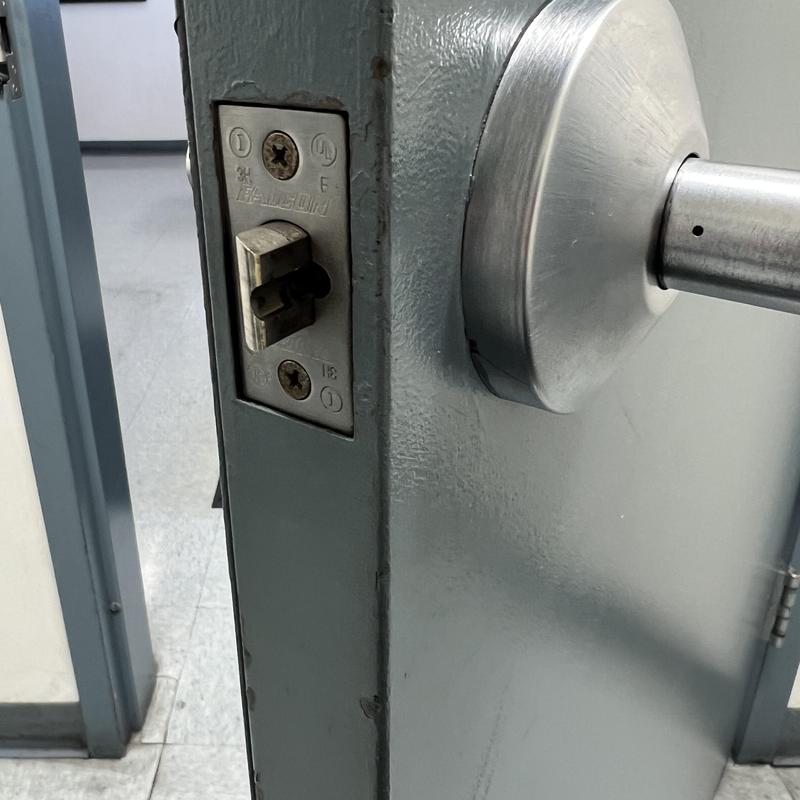 Door lever locking mechanism replacement on metal door