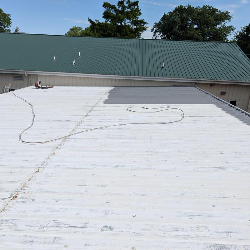 Commercial metal roof with elastomeric coating application