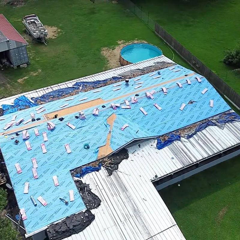 Roof underlayment installation with synthetic blue cover