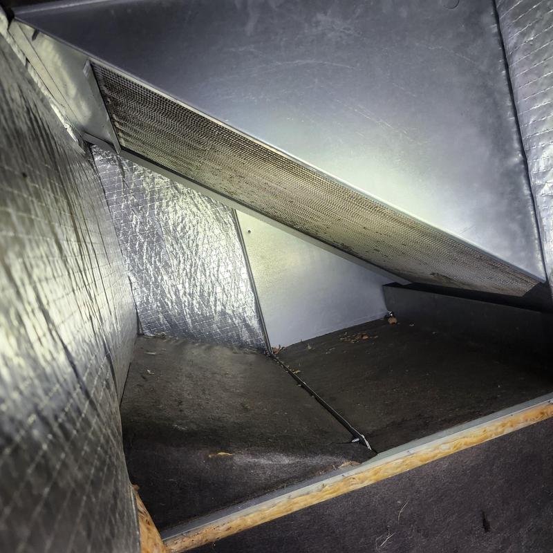 Package unit interior showing dirty evaporator coil and pan Package unit interior showing dirty evaporator coil and pan