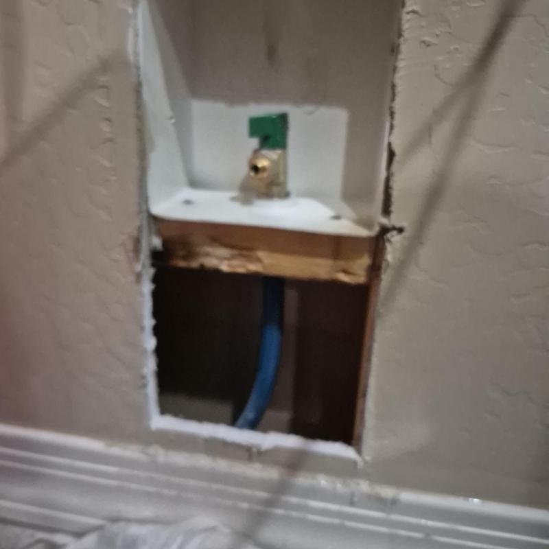 Ice maker valve with water line behind wall opening
