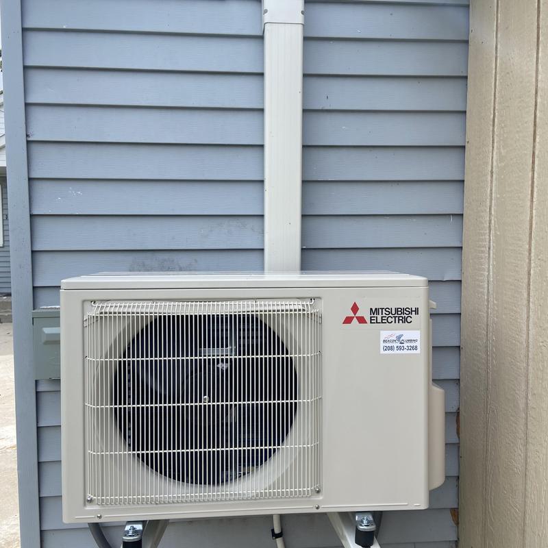 Mini split outdoor unit installed on siding wall