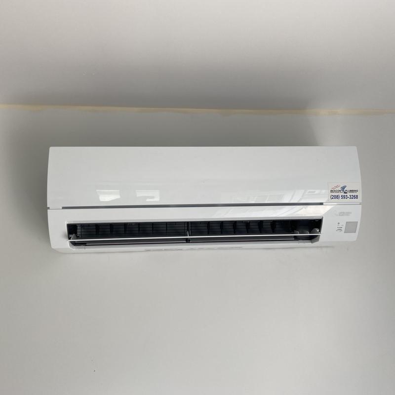 Mini split unit installed on wall, functional check
