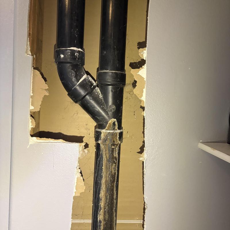 DWV ABS pipe vent behind drywall with water damage