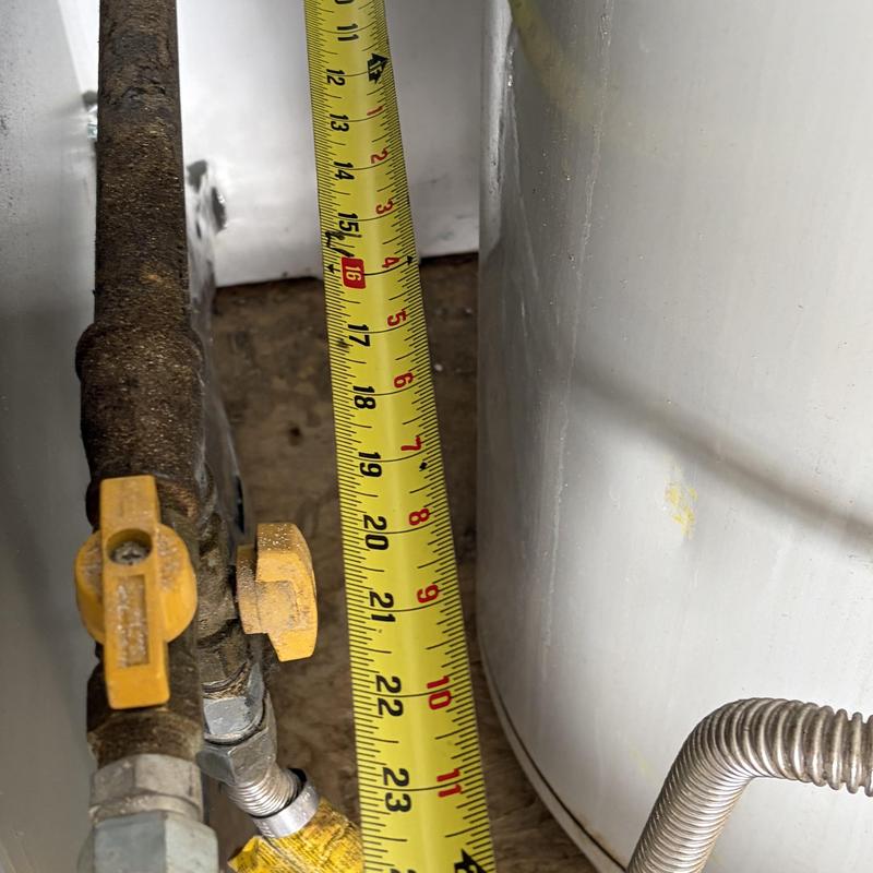 Water heater clearance measurement with tape measure