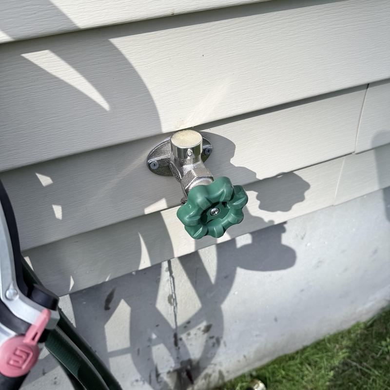 Frost-free outdoor hose bib on house siding Frost-free outdoor hose bib on house siding