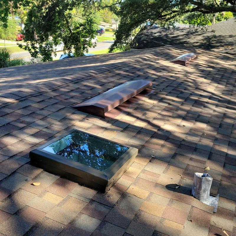 Owens Corning shingle roof with vents and skylight Owens Corning shingle roof with vents and skylight