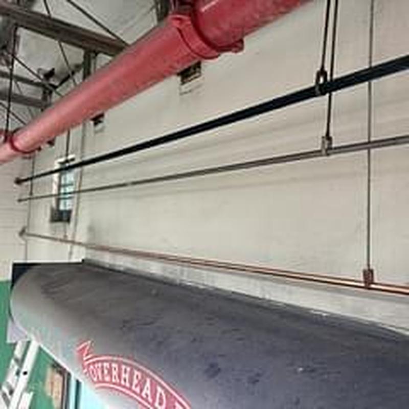 Copper water line installation in boiler room wall
