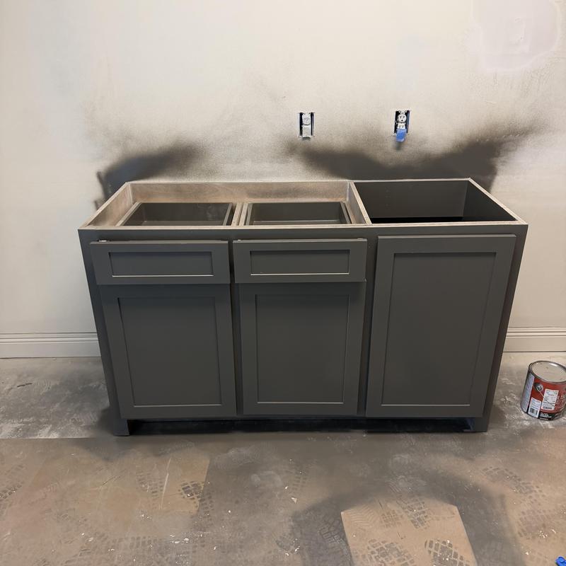 Kitchen base cabinets installation with gray paint