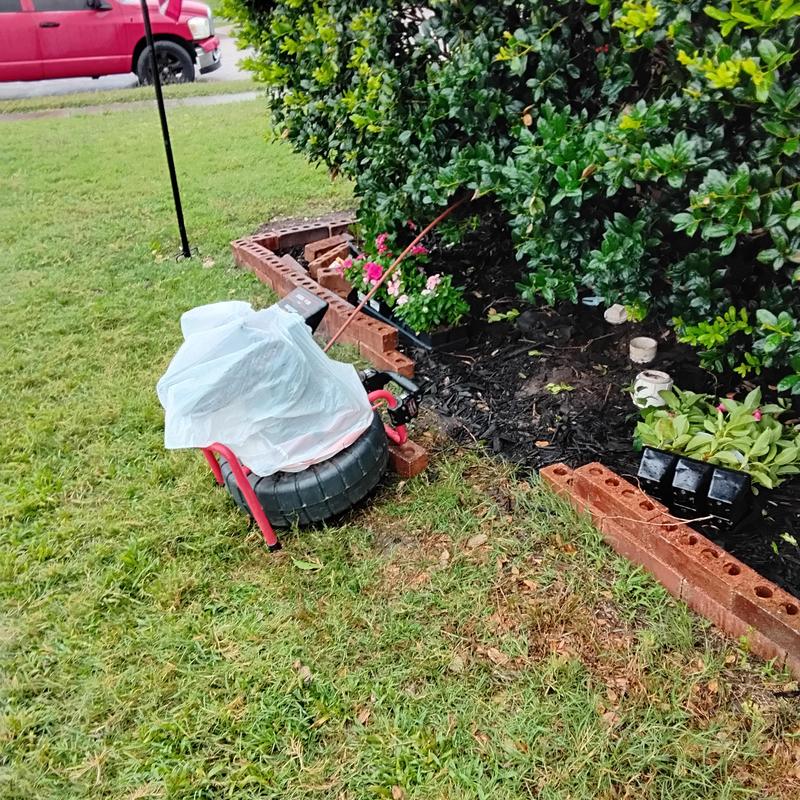 Drain cable machine clearing stoppage near yard plants