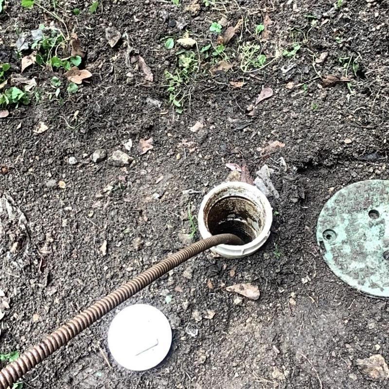 Main sewer line with cable inspection tool in soil
