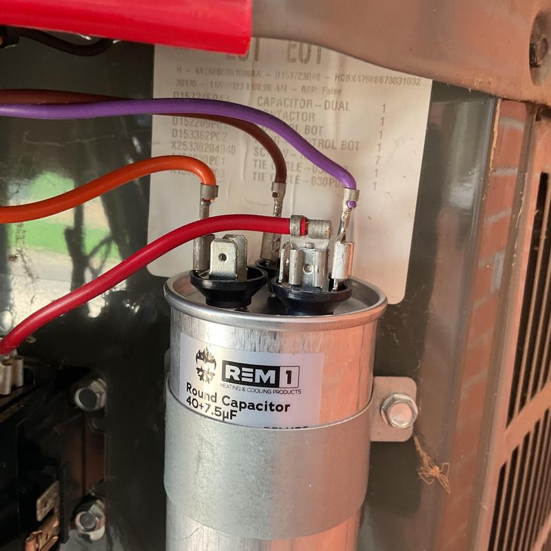 Dual round capacitor with wiring in HVAC unit Dual round capacitor with wiring in HVAC unit