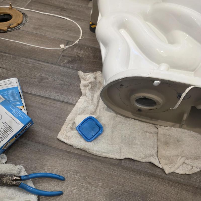 Toilet base removed for reset on floor tiles Toilet base removed for reset on floor tiles