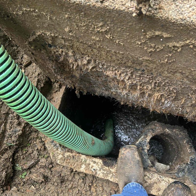 Septic tank lid and riser installation with hose