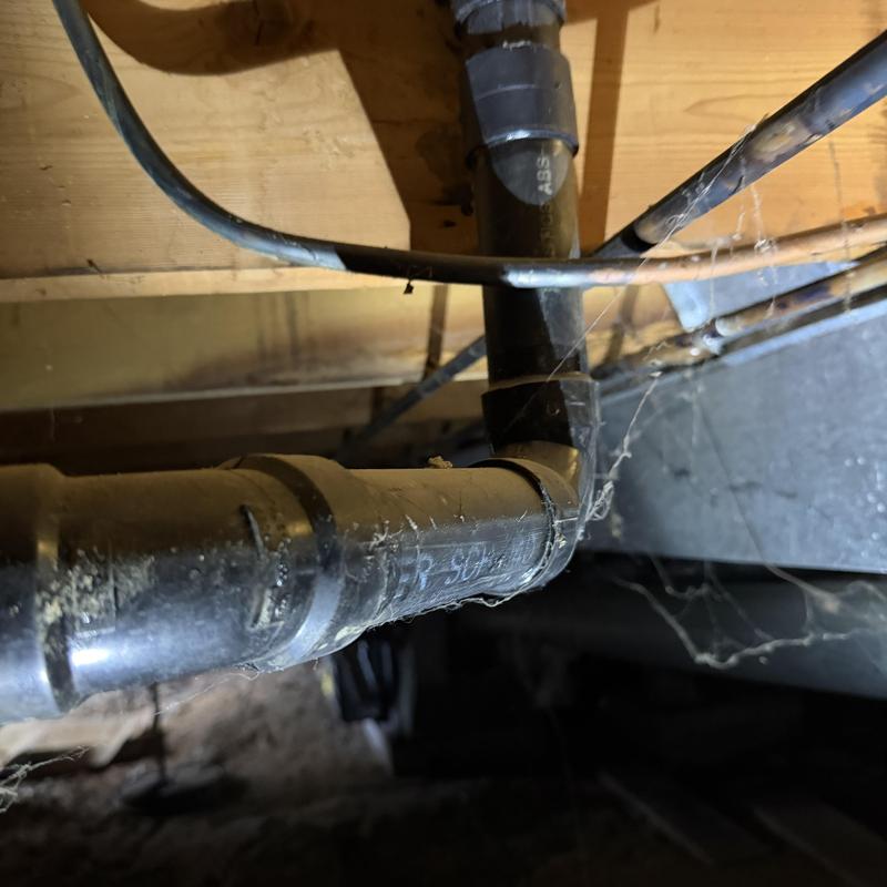 Dishwasher drain pipe under floor joists with wiring Dishwasher drain pipe under floor joists with wiring