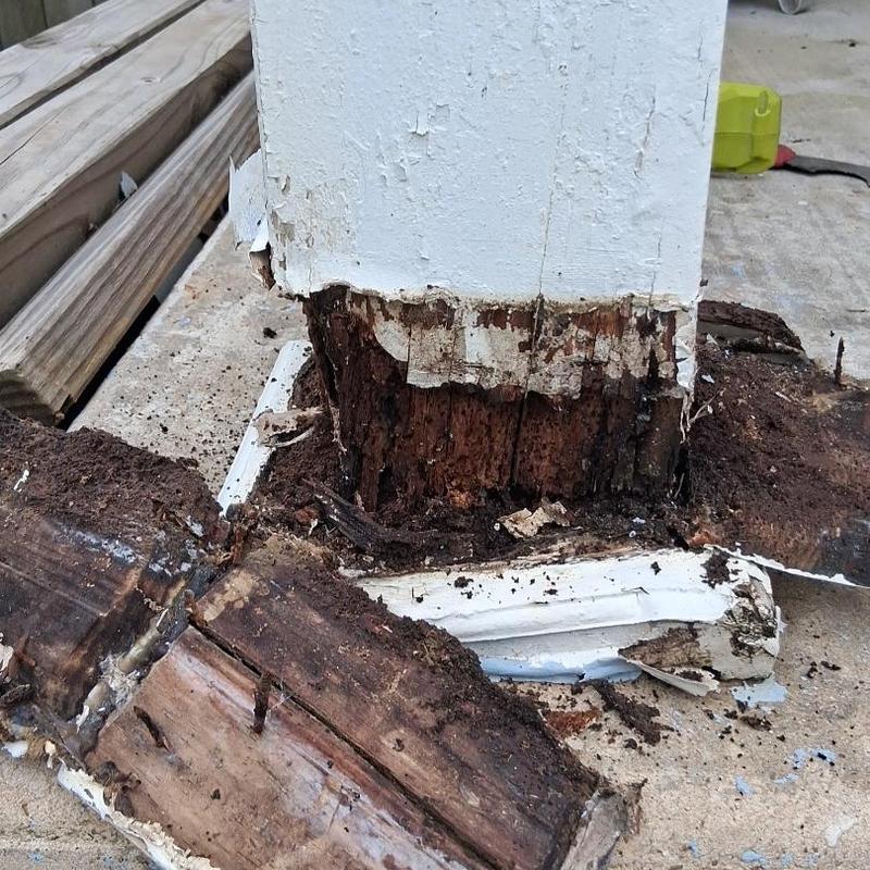 Porch support post with extensive wood rot and damage Porch support post with extensive wood rot and damage