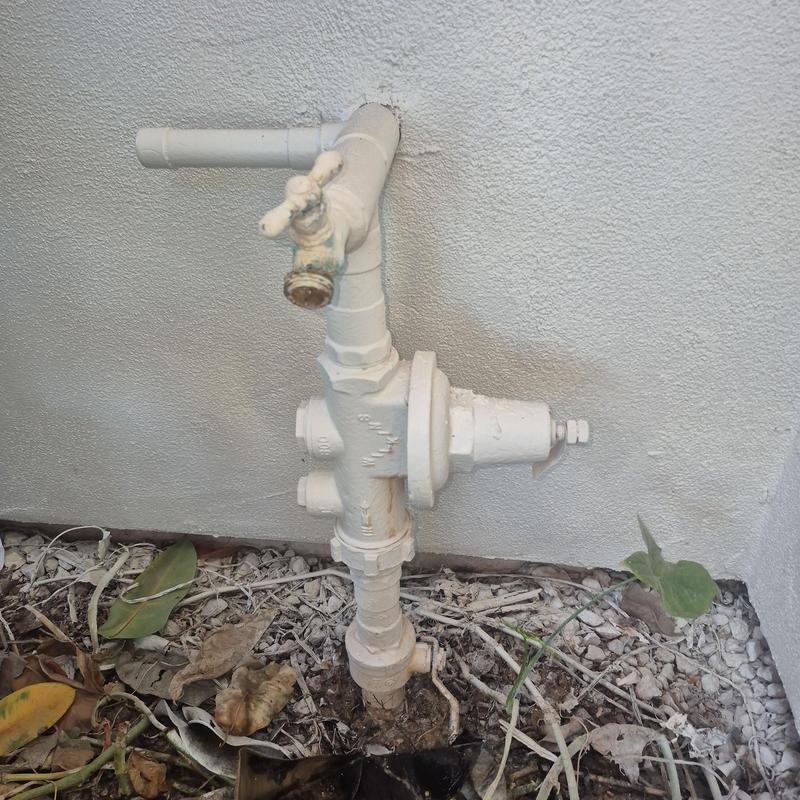 Pressure regulator valve with outdoor hose bib installation
