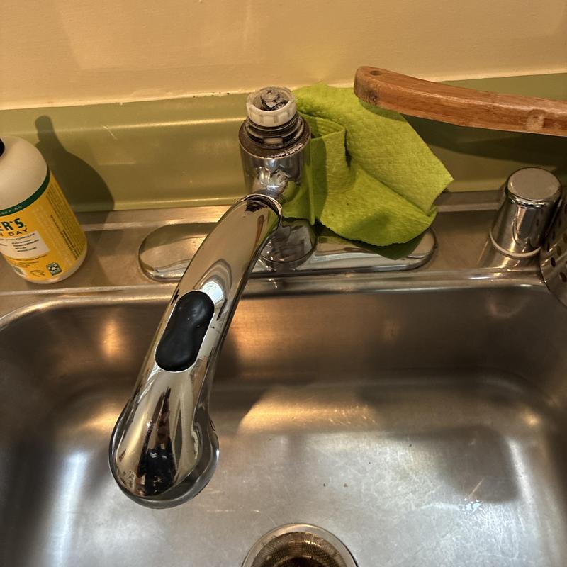 Kitchen faucet with removed handle on stainless sink