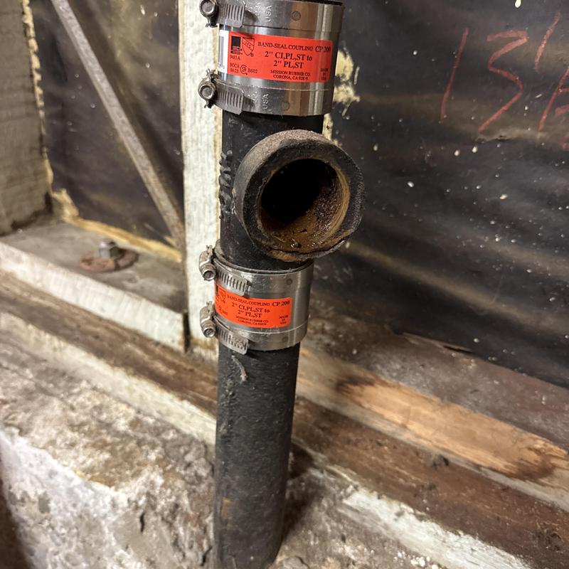 Cast iron drain line with stainless steel clamps