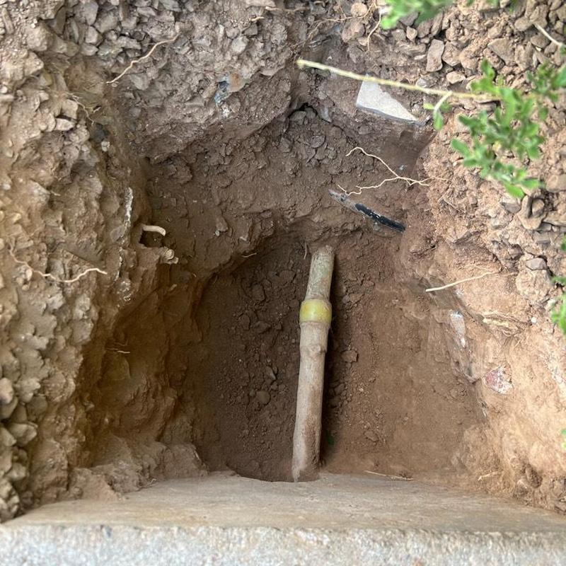Main water line excavation with new pipe fitting