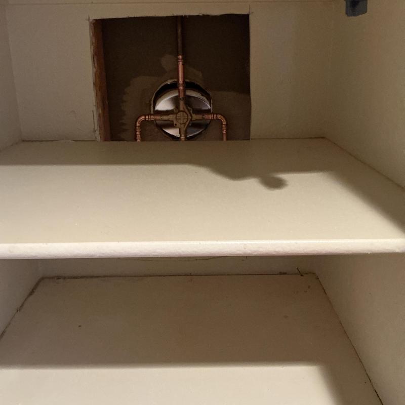 Tub shower valve with copper piping behind drywall access hole