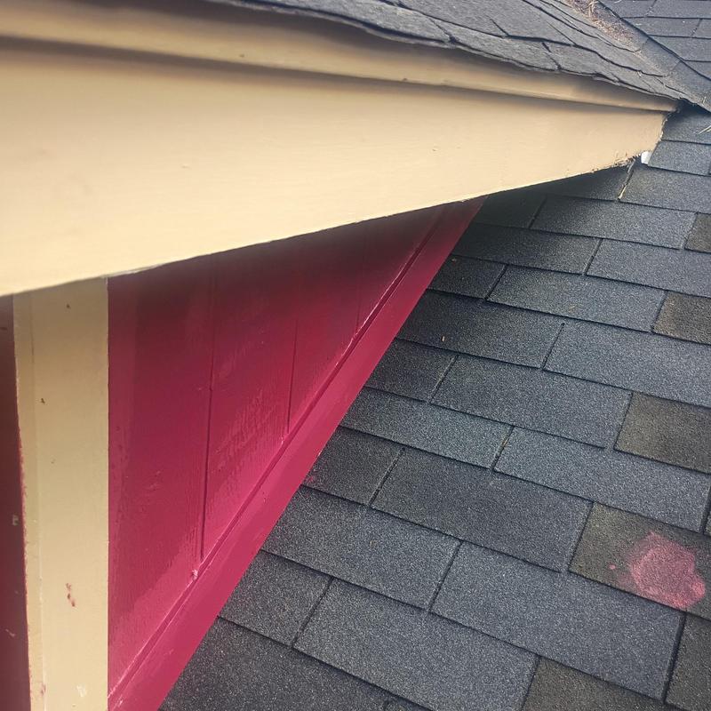 Corner boards and roof shingles at home exterior
